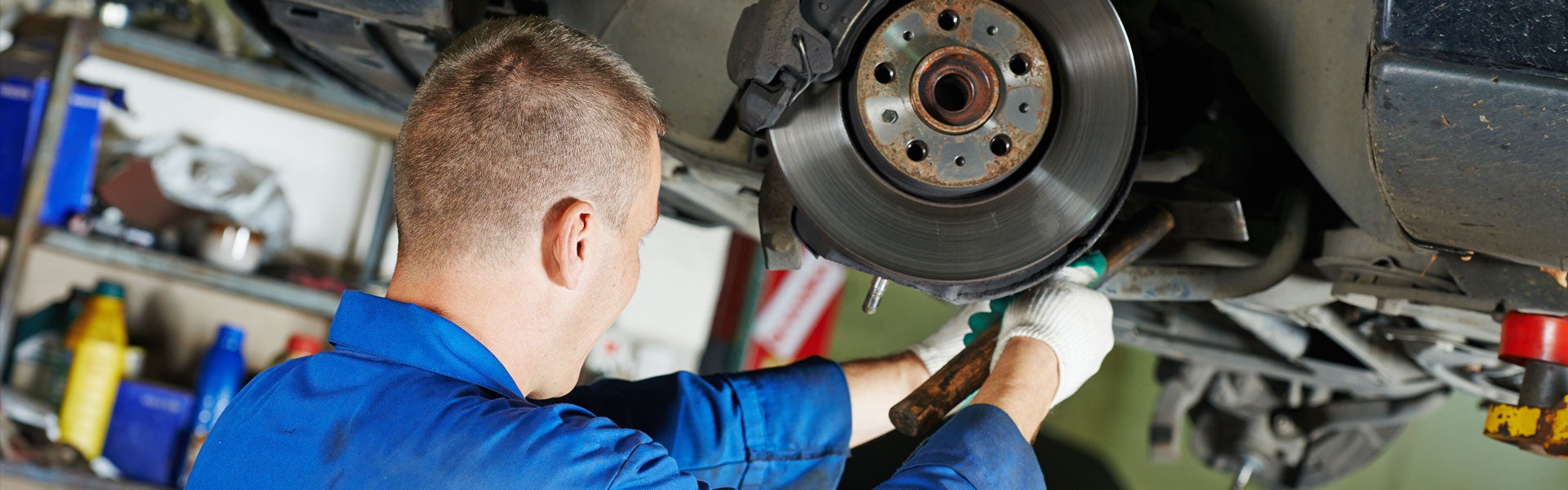 A man repairing car brake