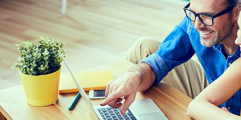 Spence Chevrolet GMC customer looking at frequently asked questions